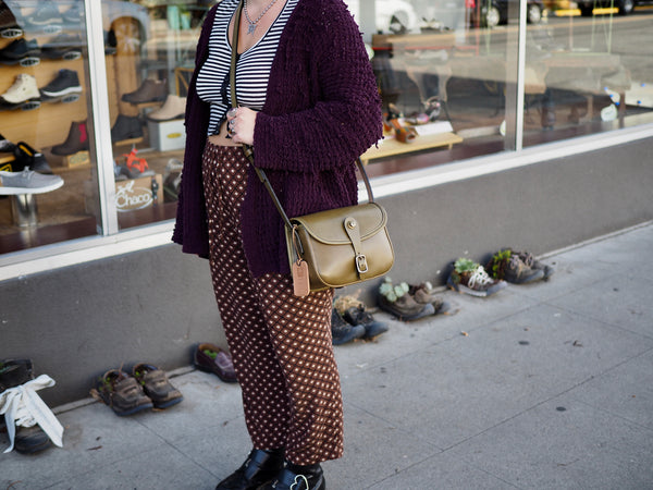 Olive green leather purse with flap.  Solid brass quick release snap and rounded buckle.